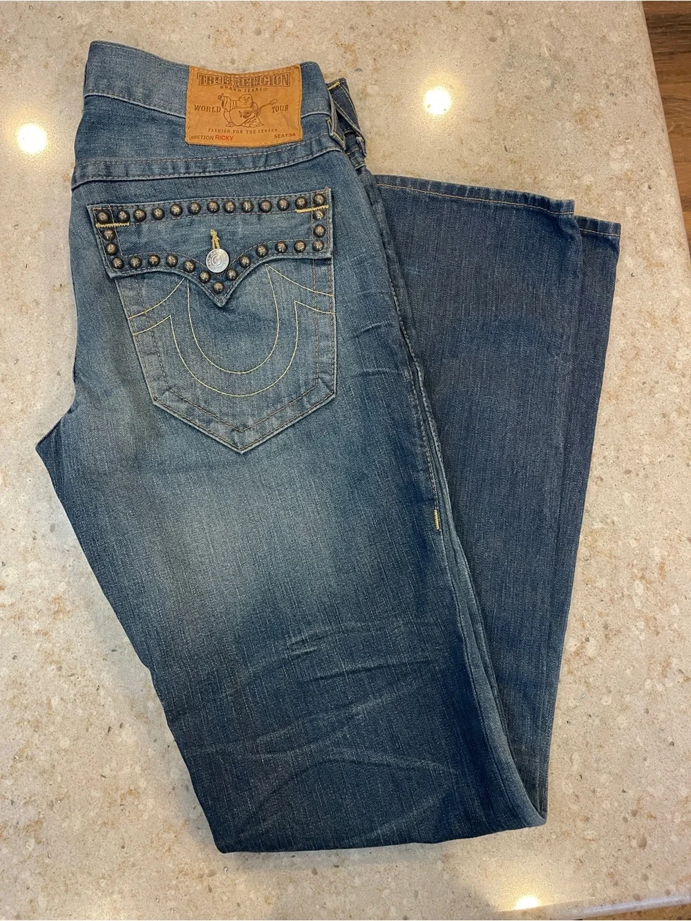 True Religion Men's Bootcut Jeans in Washed Blue with Stud Detail